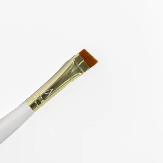Angled Brow Brush with white handle and gold ferrule on a white background
