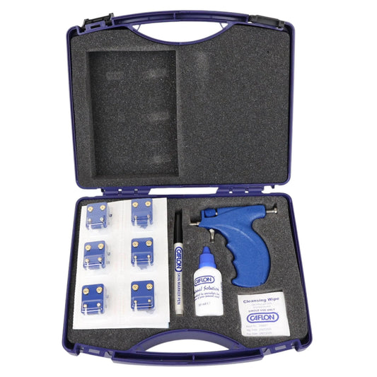 Open tool case with blue tool, bottles, and components on a white background