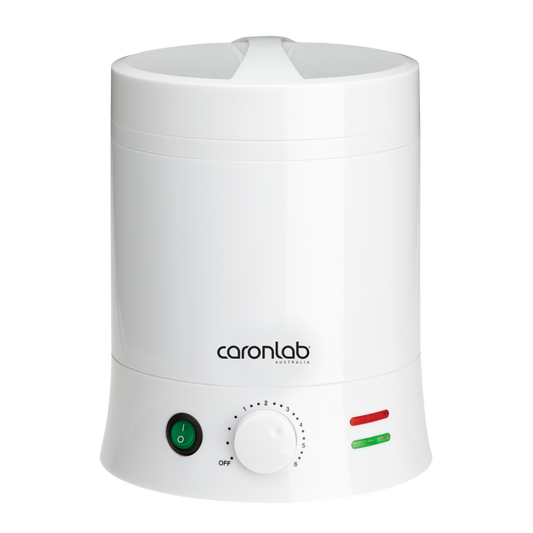 A white Caronlab professional wax heater with a metal insert, temperature control dial, and indicator lights.