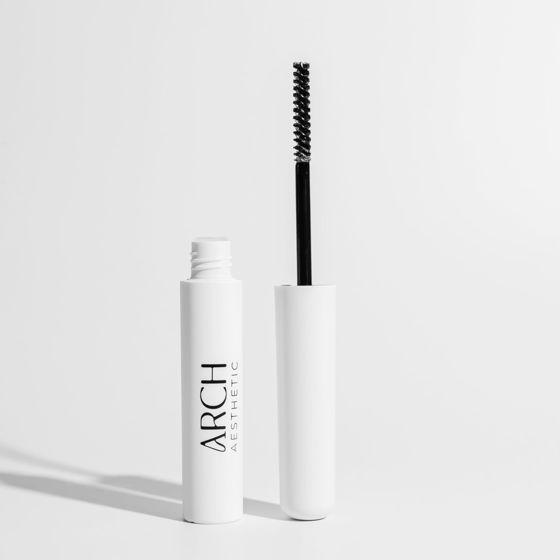 Mascara with brush on a white background