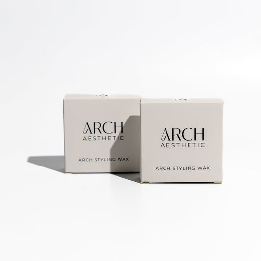 Two boxes of Arch Aesthetic styling wax on a white background