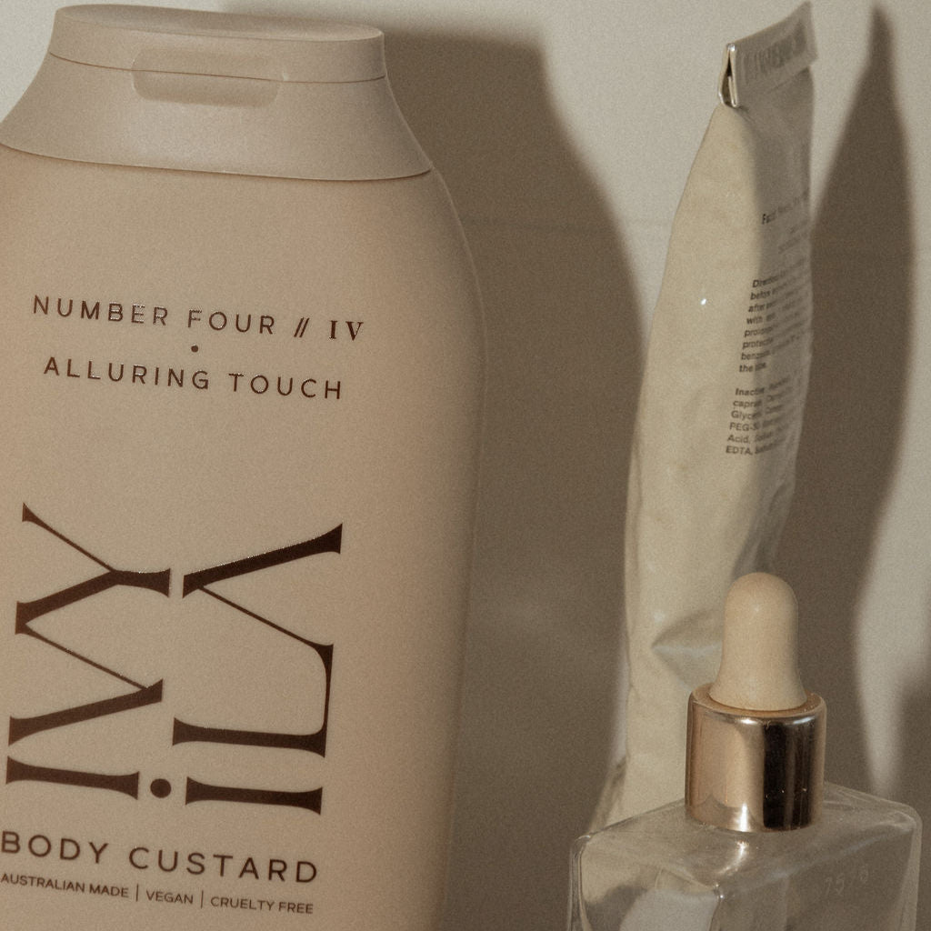 Body custard bottle and dropper bottle on a neutral background