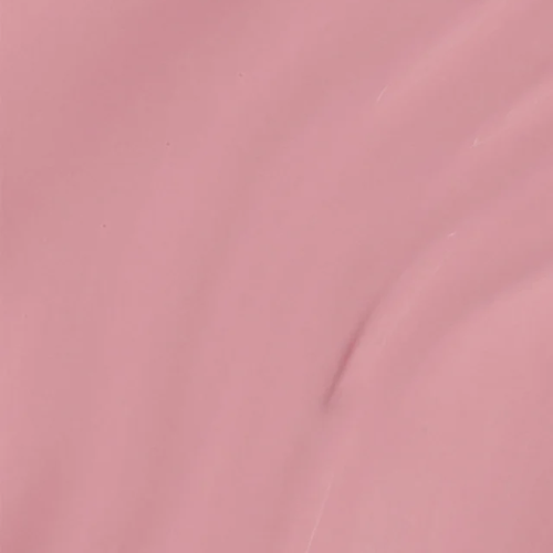 A close-up of a smooth, matte dusty pink surface with soft folds and subtle shading.