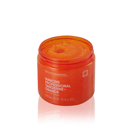 Orange jar of Manche Professional Tanning product on a white background