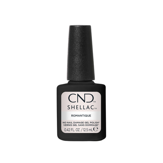 A bottle of CND Shellac nail polish in the shade Romantique, featuring a black bottle and cap with a light pink label on a solid white background.