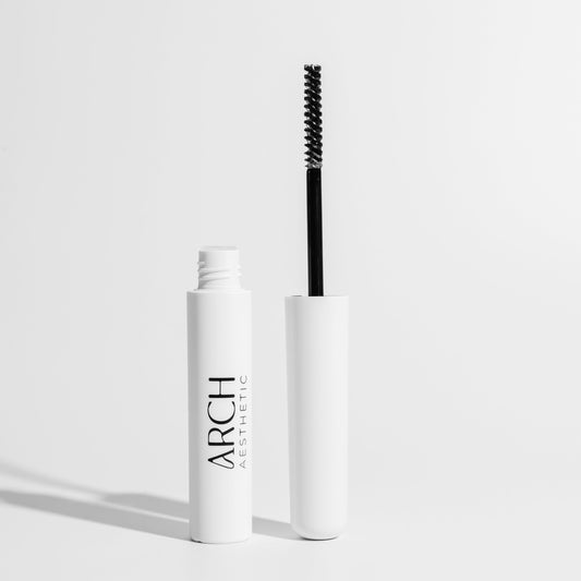 Mascara with brush on a white background