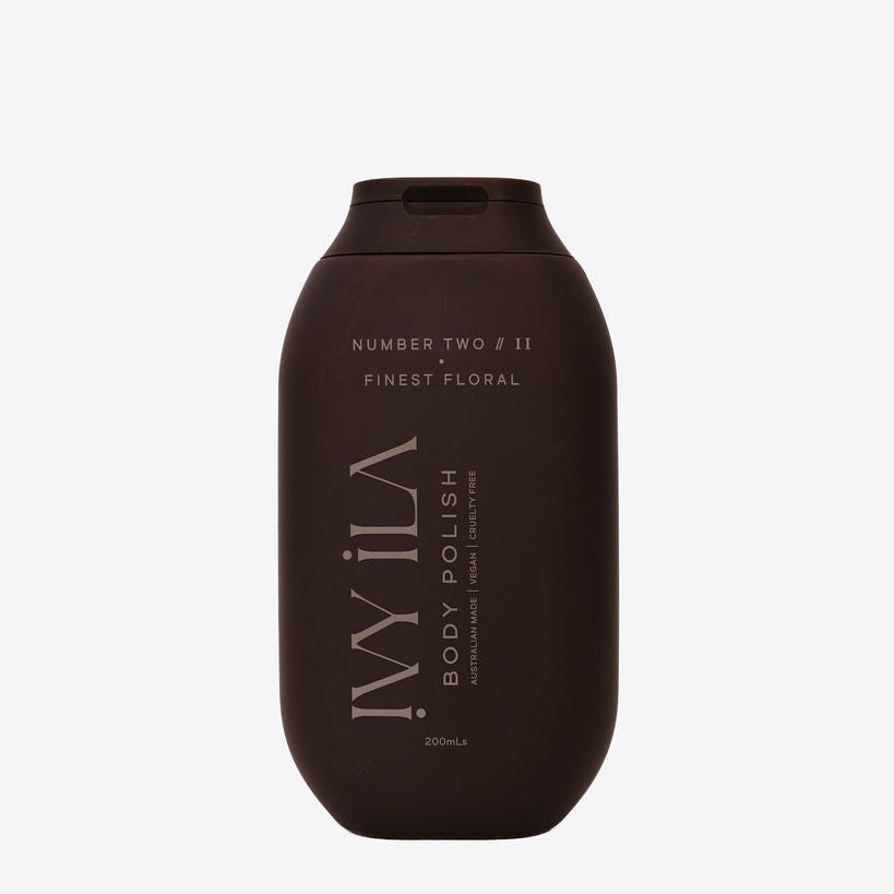 Brown bottle of 'Wila' body polish on a white background