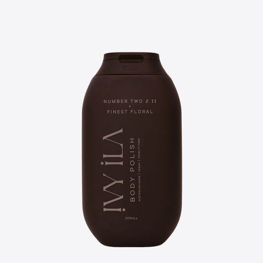 Brown bottle of 'Wila' body polish on a white background