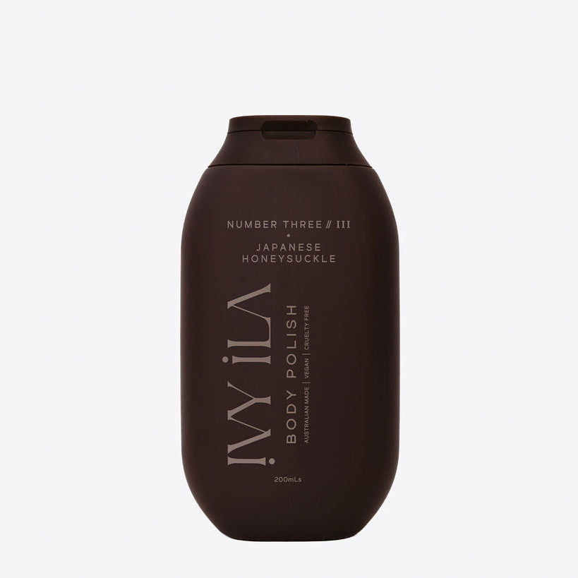 Brown bottle of body polish with text on a white background