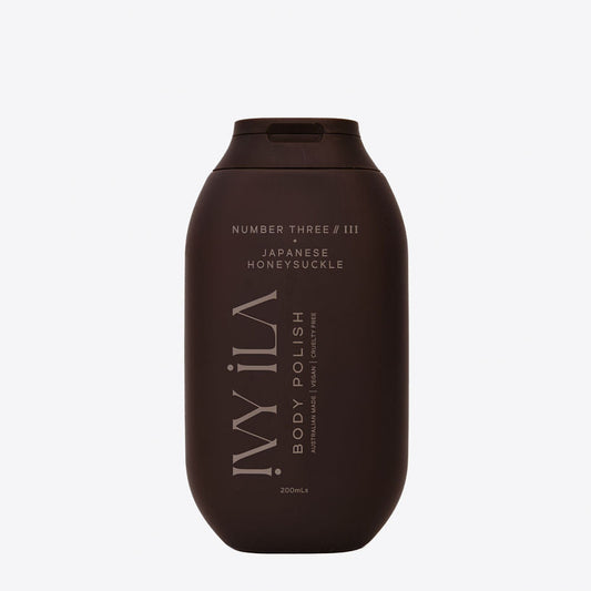 Brown bottle of body polish with text on a white background