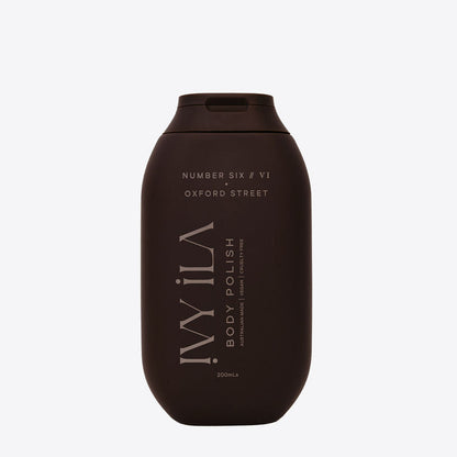 Brown bottle of ILA body polish on a white background