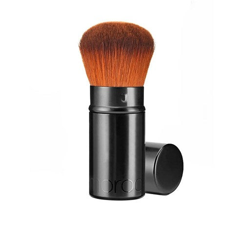 Makeup brush with black handle and brown bristles on a white background