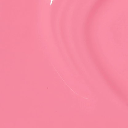 A close-up of a smooth pink surface with soft curved highlights and a tiny white streak near the top center.