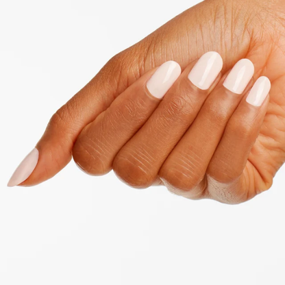 A close-up of a hand with long, almond-shaped nails painted in a glossy pale pink color, set against a solid white background.